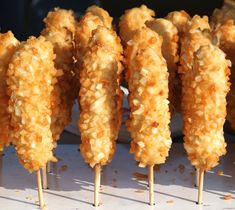 several skewers of food sitting on top of a table