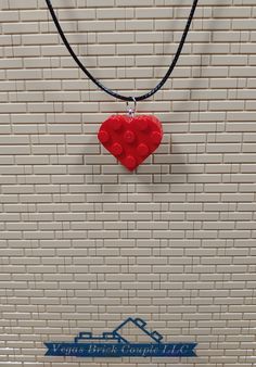 Custom handmade Heart Necklace made with genuine Lego® pieces. The necklace is made from waxed cotton cord and is 20” long and 1.5mm thick with a 2" extender chain and lobster clasp. These are made with all new parts including two standard Lego® heart shaped plates that have been glued together to provide long term durability. Vegas Brick Couple LLC is not affiliated with LEGO®. This product is fan art and the LEGO logo, are registered trademarks of The LEGO Group, which does not authorize, spon Handmade Adjustable Heart Necklace For Valentine's Day, Red Adjustable Heart-shaped Necklace, Red Adjustable Heart Necklace, Adjustable Red Heart Necklace, Red Heart-shaped Adjustable Necklace, Red Adjustable Heart Pendant Necklace, Adjustable Red Necklaces With Heart Charm, Adjustable Red Heart Necklace Gift, Red Adjustable Heart Necklace As A Gift