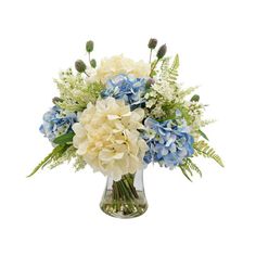 a vase filled with blue and white flowers