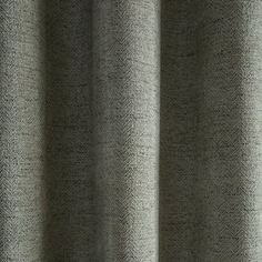 a close up view of a gray curtain