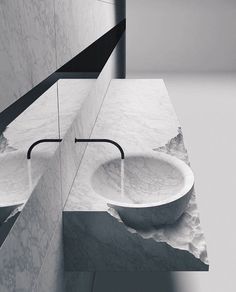 black and white photograph of two sinks in a bathroom