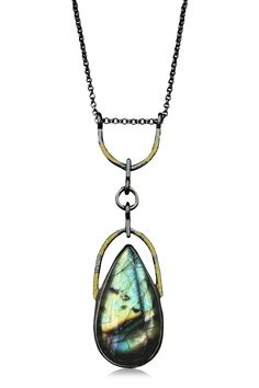 Gold, Silver & Stone Necklace - Ancient vibes meet modern lines in this shimmery labradorite pendant. Framed by textured, oxidized silver and adorned with 23k gold, its elongated teardrop shape is equally comfortable worn over a tee by day or in a plunging neckline at night. Substantial yet easy to wear, this gem flashes green and teal with lots of mysterious moonlit sparkle. Lobster clasp. Unusual Jewelry Necklaces, Labradorite Necklace Pendants, Lapidary Jewelry, Unusual Jewelry, Labradorite Necklaces, Denim Style, Class Ideas, Jewelry Outfit, Pompeii