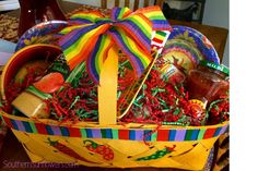 a colorful basket filled with condiments and candy