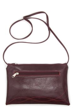 This wine crossbody bag will fit your essentials for the perfect everyday bag. Featuring an adjustable strap and a zipper closure, wear this bag over the shoulder, or across your body leaving you hands-free while on the go. Large enough to fit your phone, keys, wallet and small water bottle. Lifetime Guarantee | Made in USA• 10.5" wide x 7.5" h• 54" long adjustable strapMaterials:• Vegan glazed fabric: lead-free, Pthalate-free and machine-washable• Printed contrast lining (limited-edition deadst Burgundy Crossbody Bag With Cell Phone Pocket, Burgundy Crossbody Shoulder Bag With Removable Pouch, Burgundy Travel Bag With Cell Phone Pocket, Burgundy Crossbody Shoulder Bag With Cell Phone Pocket, Burgundy Crossbody Satchel With Adjustable Strap, Burgundy Crossbody Satchel For Everyday Use, Burgundy Bag With Cell Phone Pocket For Everyday Use, Burgundy Crossbody Bag With Adjustable Strap, Burgundy Crossbody Satchel