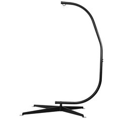 a black floor lamp on a white background with the light reflecting off it's base