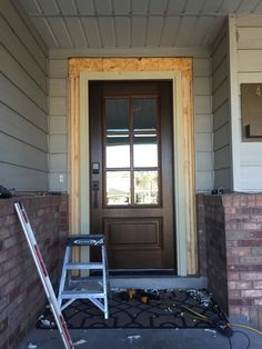 the front door of a house is being painted