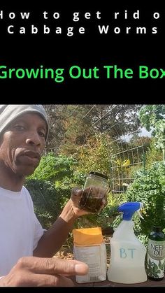 a man holding up a jar with some liquid in it and the words growing out the box behind him