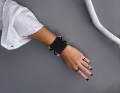 "Women's black square bracelet, black metal sharp cuff bracelet, edgy-rock style bracelet, geometric black jewelry, statement cuff, women's gift Welcome to my shop! 📌Please Kindly Note: The listing is for only one bracelet!! 📌It is made of genuine leather and matte black painted brass. All the metal parts are made of  Zamak, which have been immersed in 999o sterling silver twice! 📌It is subjected to an anti-allergic process (nickel and lead-free). 📌Many of our jewelry has been through an oxidation process. Therefore, some natural black marks or imperfections on production may occur for a more obvious vintage-aged tone but oxidation naturally wears off over time. 📌IMPORTANT!! Please keep in mind that due to the size of the metal plate, we recommend sizing up! 📌For BLACK PAINTED jewelr Black Edgy Bracelets As Gift, Black Punk Cuff Jewelry, Modern Leather Bracelet For Parties, Modern Leather Bracelet For Party, Trendy Black Cuff Leather Bracelet, Edgy Black Bracelet Strap Jewelry, Adjustable Black Cuff Bracelet For Fashion, Modern Black Leather Bracelet For Party, Edgy Black Metal Cuff Bracelet