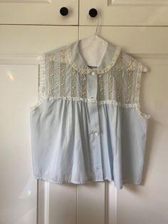 Beautiful vintage shirt with lace & embroidery  In good condition. Has been professionally dry cleaned. Lace Trim Button-up Tops For Daywear, Lace Button-up Top With Lace Collar, Elegant Blue Top With Lace Collar, Button-up Tops With Lace Collar For Daywear, Lace Collared Top For Daywear, Short Sleeve Cotton Blouse With Lace Patchwork, Summer Daywear Shirt With Lace Trim, Fitted Blue Tops With Lace Collar, Blue Fitted Top With Lace Collar