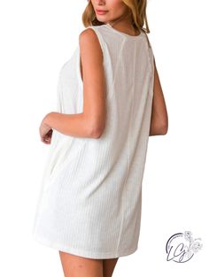 The Sundance Ribbed Tunic Tank is a versatile and stylish top that combines comfort with a touch of sophistication. This tank top features a ribbed texture, adding visual interest and a flattering fit. The tunic length offers extended coverage, making it suitable for pairing with leggings, jeans, or shorts. The sleeveless design allows for easy movement and keeps you cool during warmer days. Crafted from soft and breathable fabric, it provides all-day comfort. The Sundance Ribbed Tunic Tank can Chic Ribbed Tops For Loungewear, Spring White Tank Top With Ribbed Neckline, Spring Beach Ribbed Top, Spring Ribbed Top For Beach, Sleeveless Ribbed Loungewear Top, Ribbed Tank Top For Beach, Ribbed Tops For Beach, Ribbed Tank Top For The Beach, Chic Ribbed Tank Top For Beach