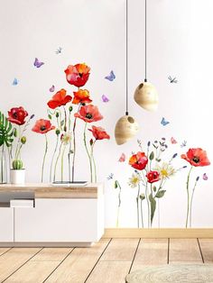 a room with flowers and butterflies on the wall