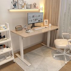 a desk with a computer on top of it