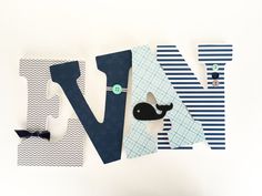 the letters n and v are made up of paper, scissors, and other items