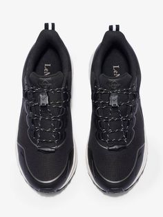 a pair of black sneakers with white laces