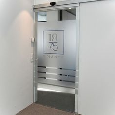 the entrance to an office building with glass doors and logo on the door, which reads'19 finance '