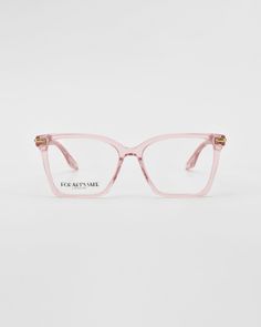 A pair of light pink eyeglasses with a slight cat-eye shape and gold accents on the temples Metal Embellishments, Luxury Eyewear, Optical Glasses, Square Frames, Spectacles, Gold And Silver, Embellishments, Silver Tone