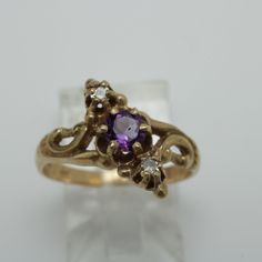 Victorian Amethyst Diamond Ring 14k Gold Size 6 14k Yellow Gold Size 6 can be sized at a low cost  The Ring is 12.5mm across by 4.2mmin Height  Diamond 0.08ct total and Amethyst 0.30ctmm  Comes with a new gift box item # 5826 Purple Diamond Ring In 14k Gold, 14k Gold Purple Ring With Diamond Accents, Yellow Gold Amethyst Ring With Diamond, Formal Yellow Gold Amethyst Diamond Ring, Heirloom Purple Diamond Ring, Vintage Diamond Amethyst Ring For Formal Occasions, Classic Amethyst Diamond Ring In Yellow Gold, Fine Jewelry 14k Gold Purple Diamond Ring, Heirloom Amethyst Ring With Diamond In Gold