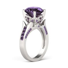 a purple diamond and white gold engagement ring