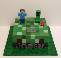 a cake made to look like a minecraft creeper with the name jaden on it