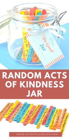 random acts of kindness jar filled with colorful labels and some scissors on the table next to it