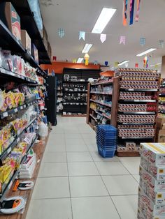 an aisle in a grocery store filled with food