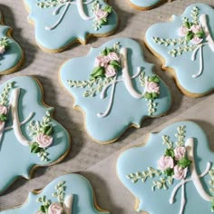 decorated cookies in the shape of bride and groom's initials