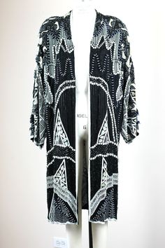 "A Fabulous Beaded Coat...with sparkle and style!! This coat is fabulous and any of these sequin coats are so hard to find..and so fabulous!! I love them!! Beaded, sequined, Embellished in every way!! Excellent!! Measuring: 42\" length Width: 60\" Sleeves: 24\" Pet Free/smoke free Enjoy! although plus size, this would be good from Medium to 2x sizes" Glamorous Embellished Black Outerwear, Glamorous Black Embellished Outerwear, Bohemian Evening Outerwear With Long Sleeves, Glamorous Beaded Outerwear For Evenings, Glamorous Beaded Evening Outerwear, Elegant Embellished Sequin Fabric For Fall, Glamorous Beaded Party Outerwear, Beaded Winter Evening Outerwear, Beaded Evening Outerwear For Winter