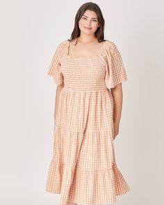 This beautiful tiered gingham print maxi dress is perfect for any occasion! It's designed with a squared neckline, smocking at the bodice and a self tie at back. This stunning piece will have you feeling like an absolute goddess! A must-have! Round out your vacation and weekend wardrobe with this plus size dress Polagram Gingham Tiered Maxi Dress | ORANGE | Dresses | Materials & Care Instructions: ['80% Polyester, 4% Spandex, 16% Rayon', 'Imported'] Plus Size Gingham Dress, Orange Gingham Dress, Square Neck Smocked Bodice Tiered Dress For Brunch, Square Neck Tiered Dress With Smocked Back For Brunch, Spring Tiered Dress With Smocked Back And Square Neck, Dresses Materials, Orange Gingham, Squared Neckline, Orange Dresses