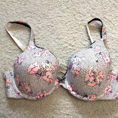 Victoria’s Secret, ,Nwot, Beautiful New 36b Underwire Bra, Light Padding, Adjustable Straps. Ivory Color With Pink Flowers, Black Lace Trim , And Silver Heart On The Striped Bow . Bra Is Very Soft Material And Silky Feel. Gorgeous! Victoria's Secret Pink Lined Bra, Victoria's Secret Pink Floral Print Bra, Spring Pink Bra With Lined Body, Fitted Pink Floral Bra, Fitted Pink Floral Print Bra, Pink Lined Spring Bra, Spring Pink Lined Bra, Bow Bra, Black Lace Trim