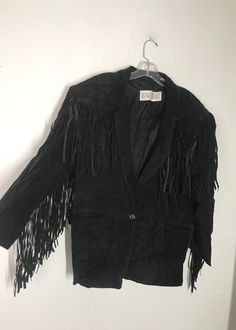 "Black men's cowboy jacket, made from real suede, soft and genuine suede, decorated with long fashionable fringe, long jacket, rocker jacket, streetstyle jacket, western jacket, vintage style, steep jacket, retro style, has size - medium. Men's cowboy jacket; made from real suede; suede is genuine and soft; long comfortable jacket - black color. Jacket has a straight form; has decoration - fashionable suede long fringe; jacket fastened via button; jacket has two outside big pockets. The lining i Western Style Suede Winter Outerwear, Western Suede Outerwear For Winter, Winter Leather Jacket With Tassels, Winter Leather Jacket With Tassels Long Sleeve, Western Tassel Outerwear For Fall, Bohemian Winter Leather Jacket With Fringe, Spring Suede Outerwear With Fringe, Spring Suede Fringe Outerwear, Western Leather Jacket With Fringe For Winter