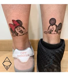 two mickey and minnie mouse tattoos on both legs