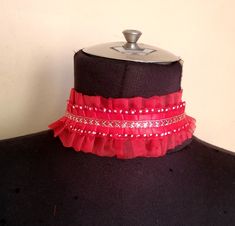 Silver in red organza ruffled collar. Can be made as a set with wrist cuffs. You can measure if you want.  length 13" READY TO SHIPP Please check your registered address on Etsy is up to date before purchasing EXSPRESS SHIPPING: need PHONE NUMBER Express shipping option available for countrys.You can see it when you buy and select your country We recommend you to send your phone number with a message in the fast cargo option. When the cargo does not find you on your adress. The product will not come back to me and it will be destroyed. The seller does not accept responsibility in this case The buyer is responsible for the customs fees. STANDART SHIPPING İtems will send you with traditional mail, PTT (Turkish Post Office) is sent as a tracking number Signed unless otherwise for delivery shi Clown Collar, Ruffled Collar, Choker Collar, Wrist Cuffs, Find You, Choker Necklaces, Up To Date, Phone Number, Phone Numbers