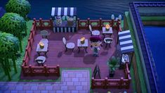 an animated image of a restaurant with tables and chairs in front of the water at night