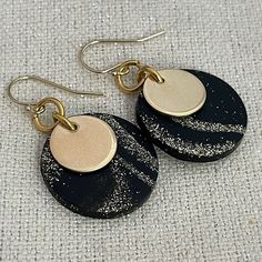 "Clay Earrings, Lightweight Dangle, Black and Gold Disc Earrings, Celestial Earrings, Neutral Earrings  1/2\" brass discs are accented by hand formed 7/8\" black polymer clay discs.  The black clay has a beautiful gold and silver celestial marbled pattern.  Each one is unique!   They hang from gold filled earwires. They measure about 1.5\" from the top of the ear wire to the bottom of the disc." Black Circular Earrings With Ear Wire, Black Circle Earrings With Ear Wire, Black Drop Earrings For Everyday, Everyday Black Drop Earrings, Nickel-free Black Drop Earrings, Black Dangle Earrings For Everyday, Black Minimalist Earrings For Jewelry Making, Single Black Round Earring, Gold Disc Earrings