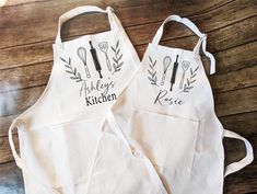 two personalized aprons with kitchen utensils on them