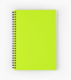 a bright green spiral notebook on a white background