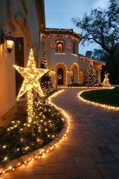 a house with christmas lights on the front yard and walkway leading up to it's entrance