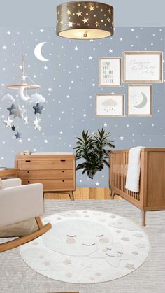 a baby's room with stars and moon decals on the wall