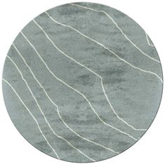 a round rug with wavy lines on the surface in grey and white colors, isolated against a white background