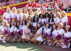 a group of cheerleaders pose for a photo