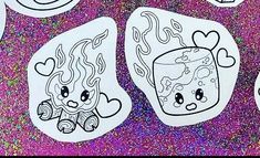 some stickers that have been drawn on the side of a purple background with glitter