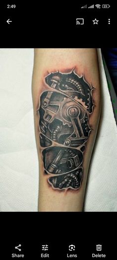 a man's leg with a tattoo design on it and an image of a skull