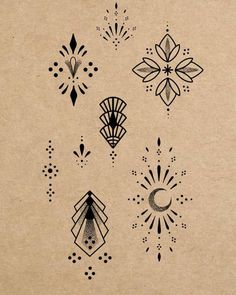 an old fashioned tattoo design on a piece of brown paper with black dots and designs