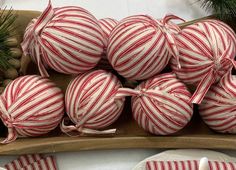 red and white striped ornaments on a wooden tray