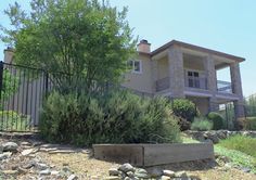 a large house sitting on the side of a hill