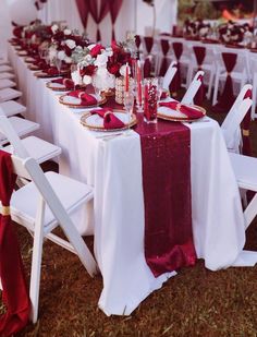 the tables are set with white and red linens