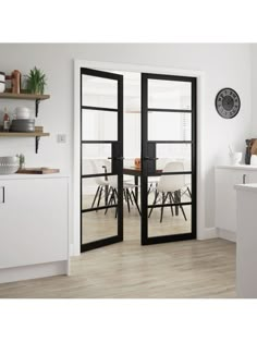 an open kitchen and dining room with sliding glass doors