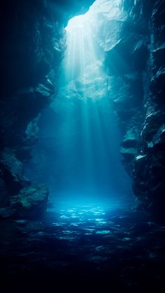 an underwater cave with sunlight streaming through the water