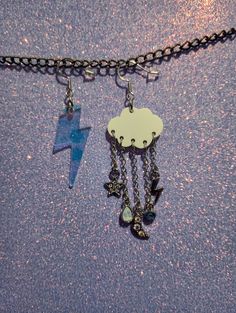 Opalescent plastic cloud with gem and crystal dangles mismatched with clear/slightly blue toned-irridescent lightning bolt. Silver findings. Storm Themed Outfits, Storm Jewelry, Lightnight Bolt Earrings, Lightening Bolt Jewelry, Rain Cloud Earrings, Lightning Cloud, Football Camp, Ear Candy, Themed Jewelry