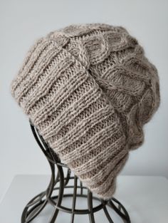 * Handed knitted winter hat/ beanie for women using wool, mohair and    polyamide blend yarn that will keep you warm and cozy during the colder   months * It is soft and warm without the chunky feeling * Color : Beige * Pamper yourself and for sure it will make a perfect gift * Materials : 1 strand of 65% Wool, 35 % Alpaca blend wool + I strand of 60%    Mohair, 20% Alpaca,20% polyamide yarn to give it's unique color and softness * Size : Fit head size 56-58cm * Height with brim folded : ~ 23cm  * Width of brim : ~ 22cm * Color may look different due to lighting, computer monitors and cell phone    screens * Hand wash in 30C and dry flat. Don't use fabric softener  * Due to the nature of Mohair, slight shedding may sometimes occur * Due to hygienic reasons, returns and exchanges can't be o Cozy Alpaca Beanie Hat, Cozy Alpaca Beanie, Alpaca Knitted Beanie For Cold Weather, Knitted Alpaca Beanie For Cold Weather, Knitted Alpaca Beanie Bonnet, Alpaca Knit Beanie Hats, Warm Mohair Beanie Hat, Knitted Alpaca Beanie Hat, Cable Knit Yarn Hats For Cold Weather